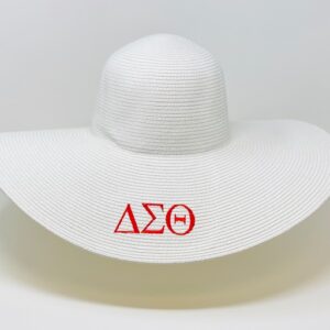 White wide brim straw hat with red DST symbols